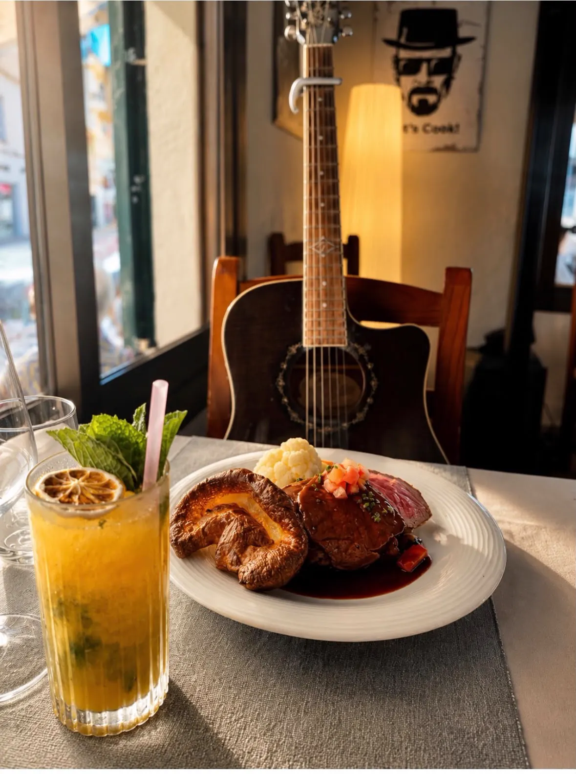 Sunday roast served next to the house guitar